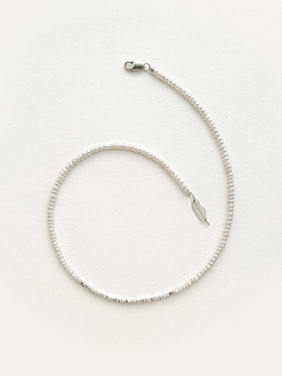 Arcenkelab Mini Pearl and Silver Necklace, featuring polished 925 silver and a minimalist design with sleek lines, perfect for any outfit.