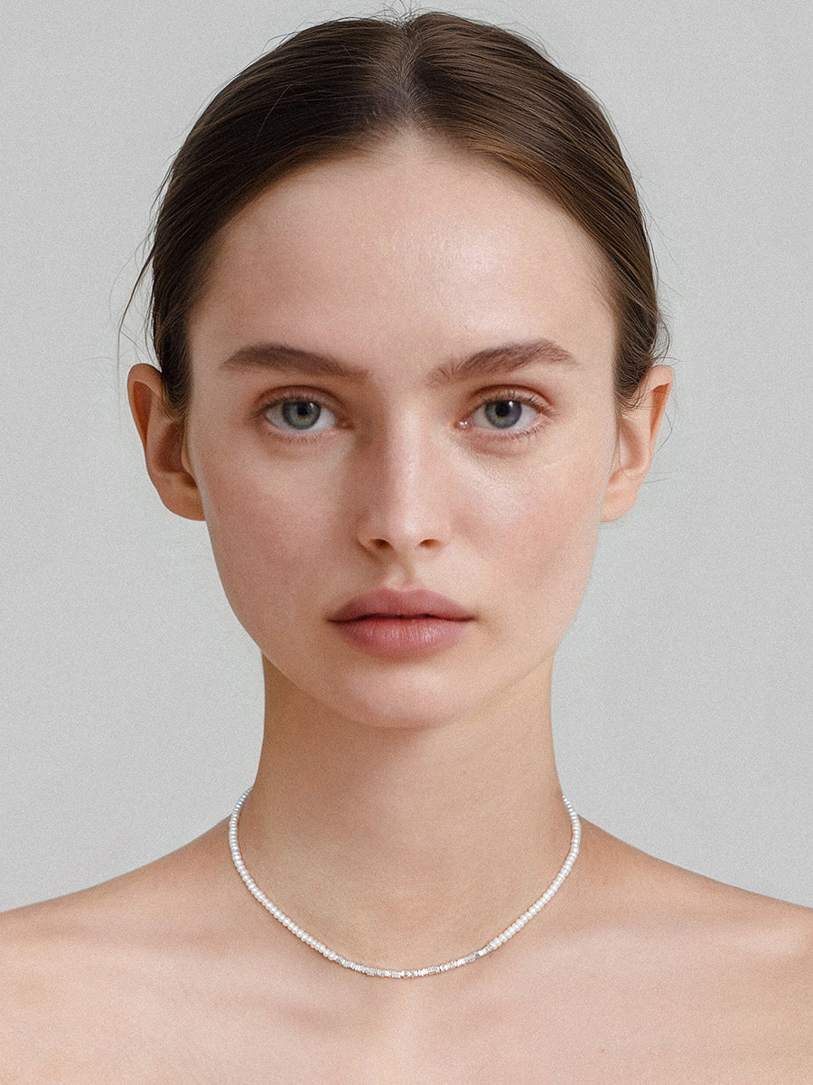 Arcenkelab Mini Pearl and Silver Necklace, featuring polished 925 silver and a minimalist design with sleek lines, perfect for any outfit.