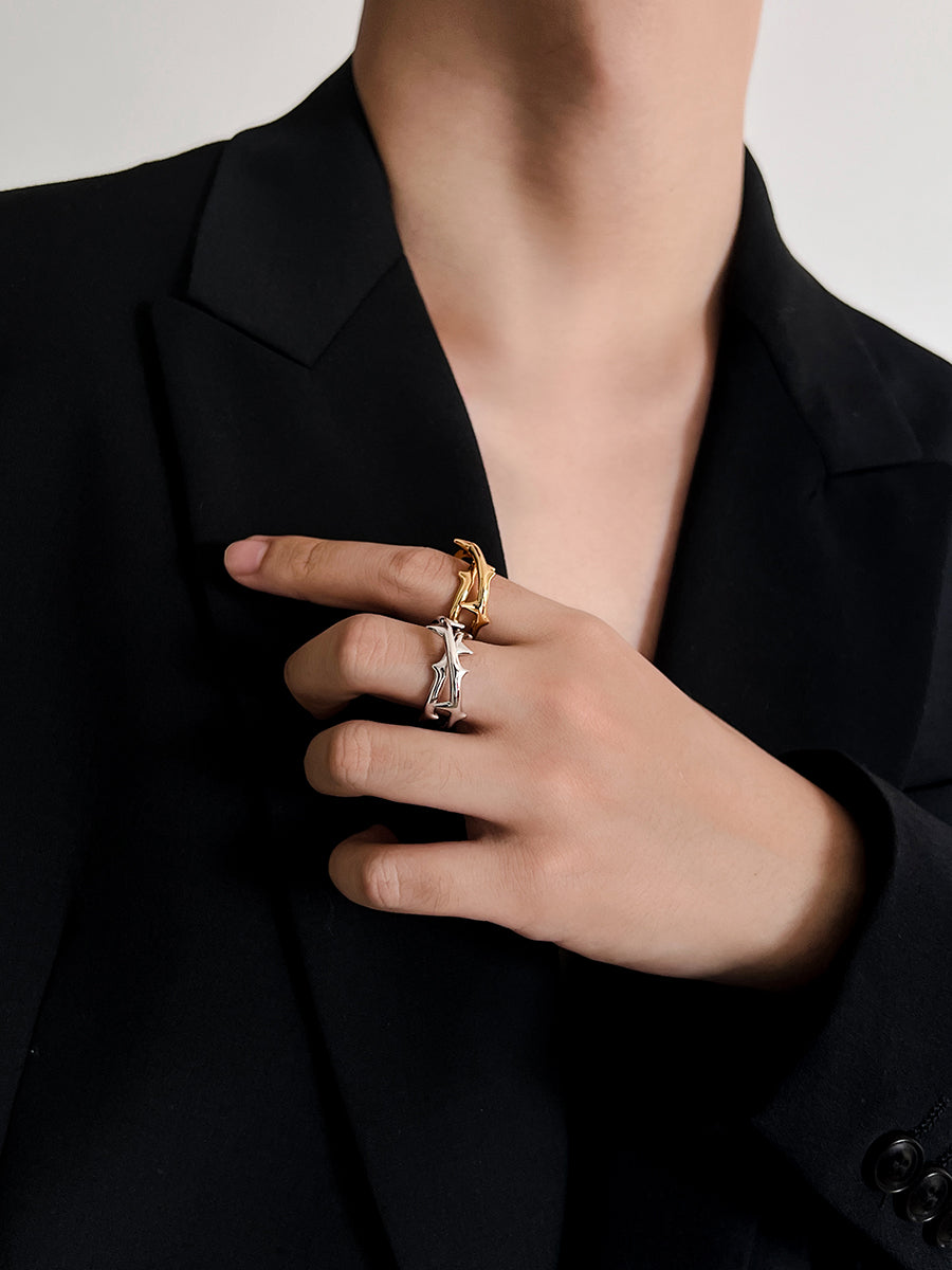 Arcenkelab Rose Thorn Ring in polished gold and silver, featuring thorn-inspired lines for a unisex, versatile accessory that elevates any outfit.