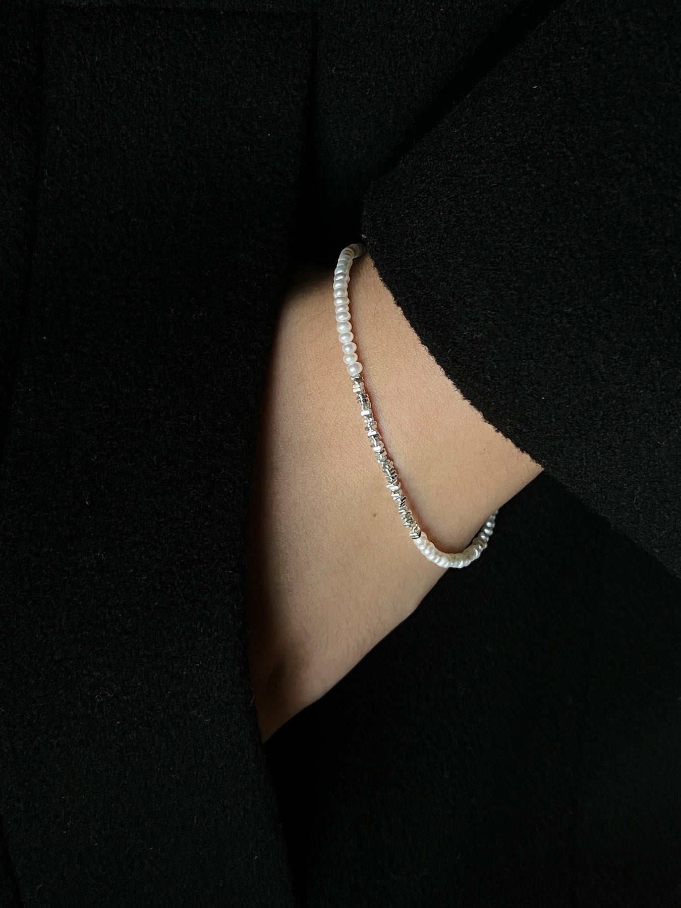 Discover the Arcenkelab Mini Pearl and Silver Necklace—a timeless blend of elegance and simplicity. Perfect for any occasion, this handcrafted piece features delicate pearls and sleek silver, making it versatile for all styles, genders, and ages.